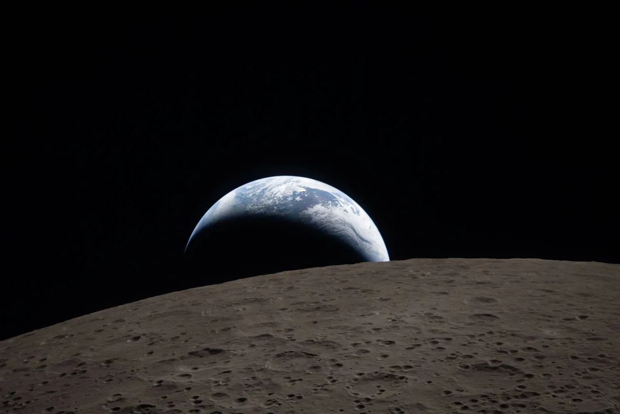 Earth rising above the lunar horizon